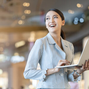 關於我們 attractive smart beautiful asian female well dress communication smartphone with cheerful confident blur public space background